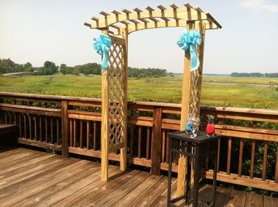 Wood Arch with Blue Bows